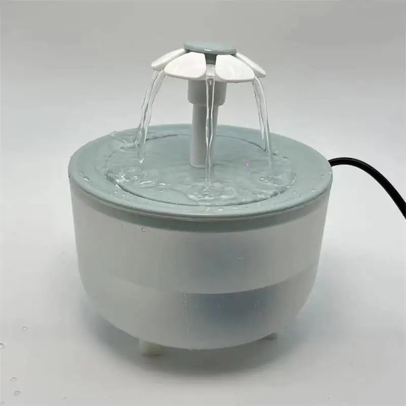 Paw Care USA automatic pet water fountain with flower-shaped spout and flowing water in white and gray