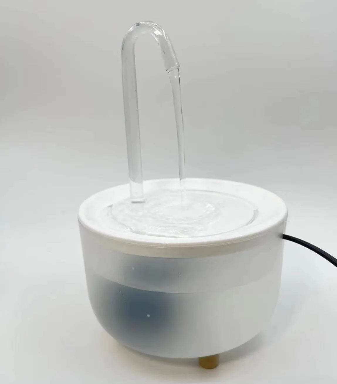 Paw Care USA automatic pet water fountain with clear water spout and white bowl design