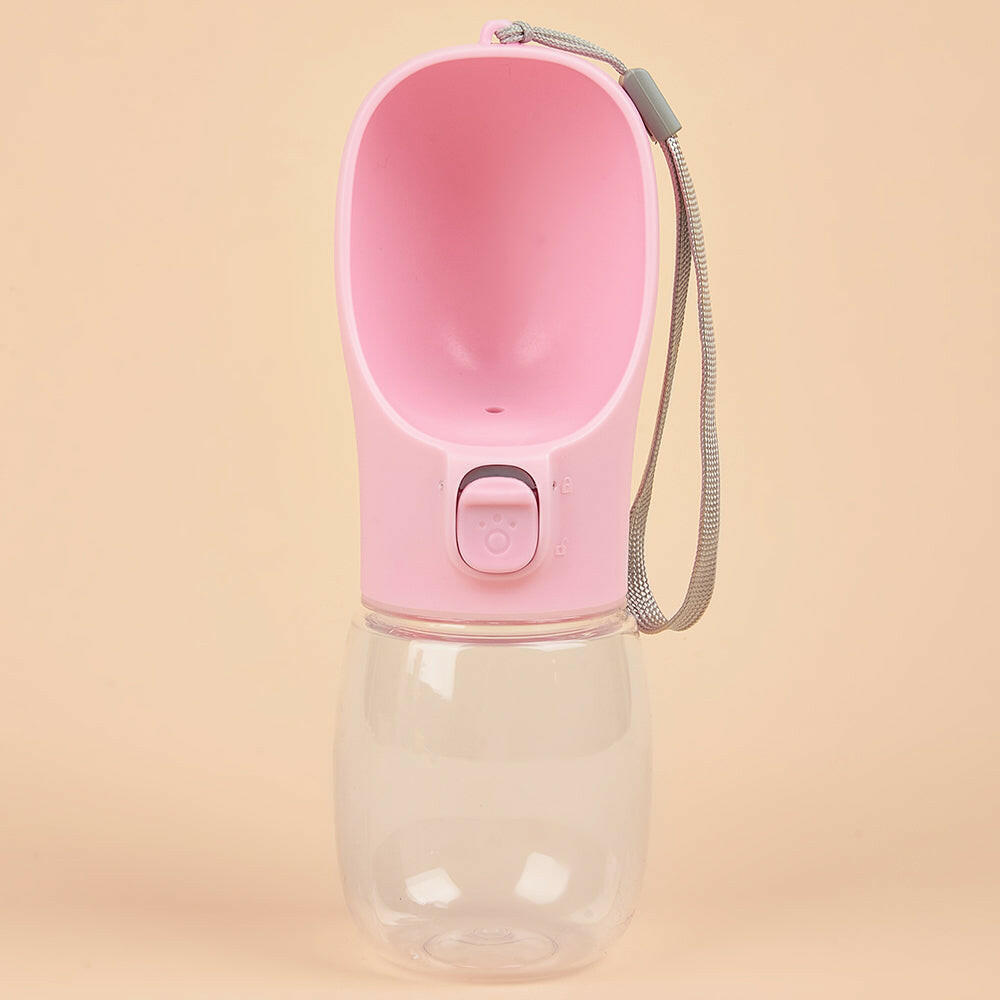 Paw Care USA pink dog and cat travel water dispenser with a built-in water bottle and wrist strap