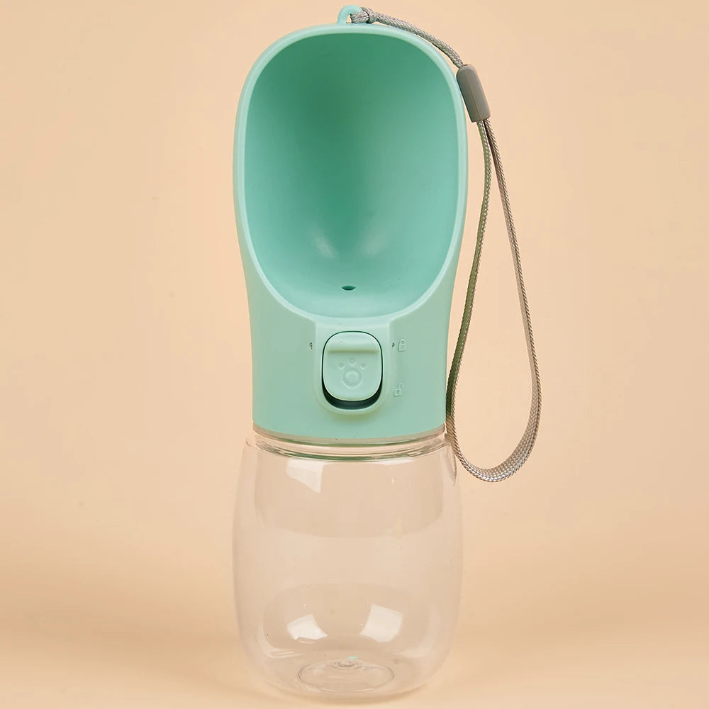 Paw Care USA dog and cat travel water dispenser in green with attached water bottle and wrist strap