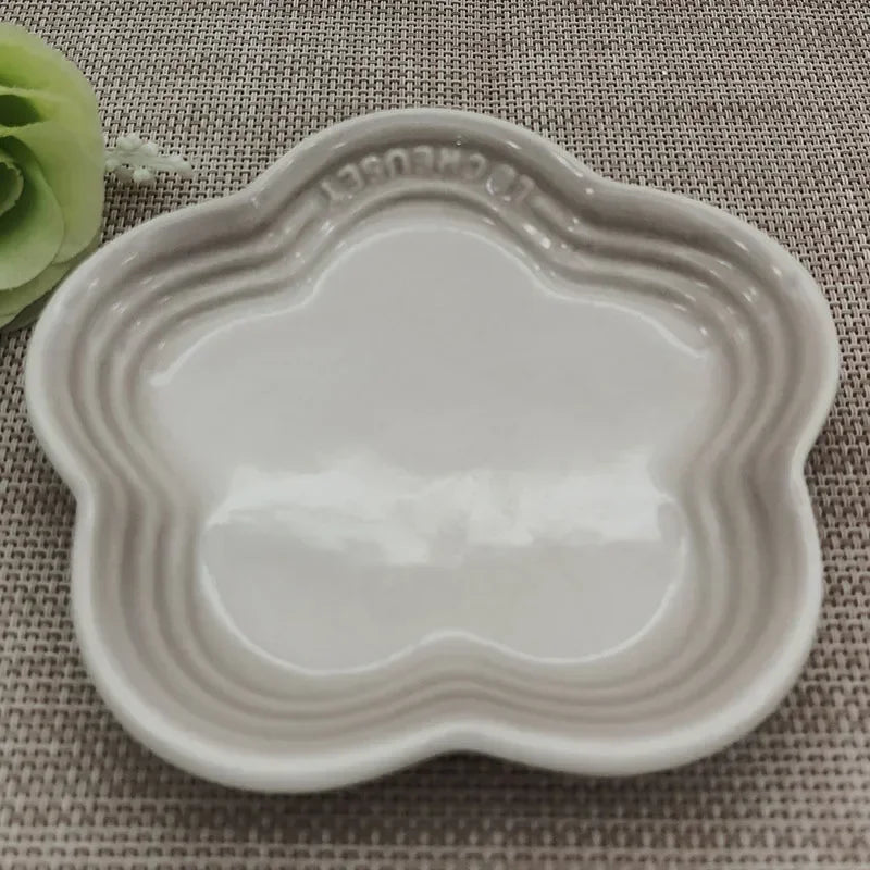 Paw Care USA whisker friendly cat bowl in white shaped like a flower with raised edges