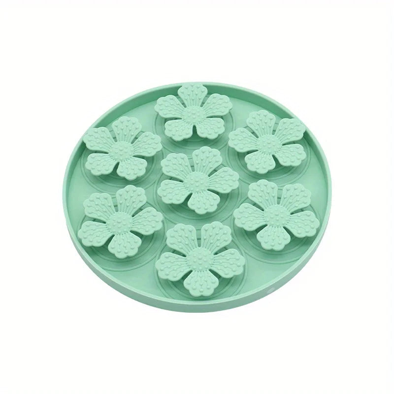 Mint green pet slow feeding bowl for dogs with raised flower-shaped sections to slow eating
