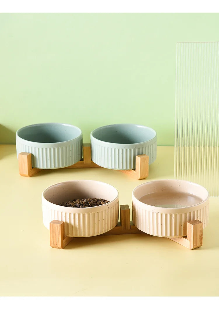 Paw Care USA premium ceramic pet food and water bowls with wooden stands in neutral colors