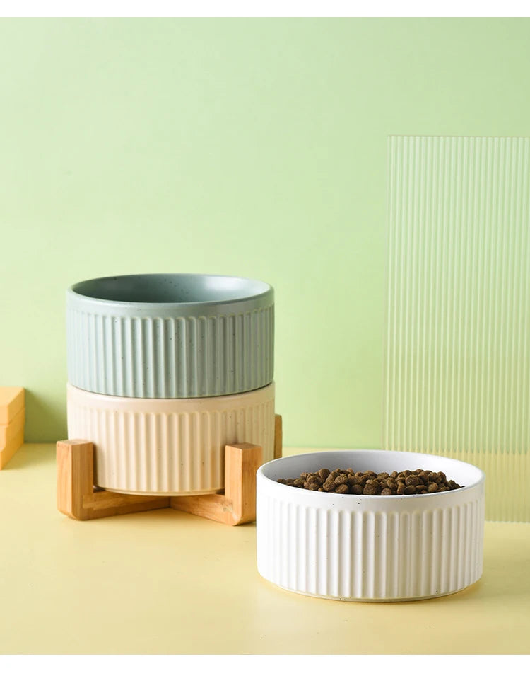 Set of premium ceramic pet food and water bowls in neutral colors with wooden stand for pets